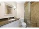Bathroom featuring a granite countertop vanity and walk-in tiled shower at 6061 Bahia Del Mar Blvd # 112, St Petersburg, FL 33715