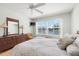 Serene bedroom with scenic views, dresser and a comfortable bed setup at 6061 Bahia Del Mar Blvd # 112, St Petersburg, FL 33715