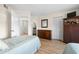 This bedroom features wood look flooring, twin beds, and closet with easy access to bathroom and kitchen at 6061 Bahia Del Mar Blvd # 112, St Petersburg, FL 33715