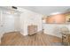 Spacious living area with wood-look floors seamlessly connects to the dining and kitchen areas at 6061 Bahia Del Mar Blvd # 112, St Petersburg, FL 33715