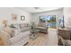 Comfortable living room with plush seating, large windows, and scenic views at 6061 Bahia Del Mar Blvd # 112, St Petersburg, FL 33715