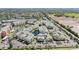 A beautiful aerial view of Stone's Throw Condominiums with a central pond and well-manicured grounds at 6915 Stones Throw N Cir # 3104, St Petersburg, FL 33710