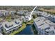 Aerial view of a residential area with bridge over water and manicured lawns at 6915 Stones Throw N Cir # 3104, St Petersburg, FL 33710