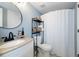 Well-lit bathroom with modern fixtures, stylish shelving, and patterned flooring, offering a blend of functionality and charm at 6915 Stones Throw N Cir # 3104, St Petersburg, FL 33710