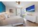 Inviting bedroom with wood floors, a large window, and stylish decor, offering a relaxing and comfortable space at 6915 Stones Throw N Cir # 3104, St Petersburg, FL 33710