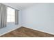 Clean and bright bedroom with hardwood-style floors and ample natural light, providing a simple and inviting space at 6915 Stones Throw N Cir # 3104, St Petersburg, FL 33710