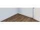 Detailed view of wood-look flooring, white baseboards, and pale-blue walls, showing a clean and modern design at 6915 Stones Throw N Cir # 3104, St Petersburg, FL 33710