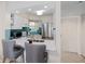 Bright kitchen with white cabinets, breakfast bar, stainless steel appliances, and stylish backsplash at 6915 Stones Throw N Cir # 3104, St Petersburg, FL 33710