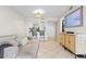 Open floor plan featuring a living room and updated kitchen with bar seating at 6915 Stones Throw N Cir # 3104, St Petersburg, FL 33710