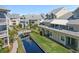Aerial view of waterfront community with beautiful landscaping, bridges, and well-maintained buildings at 6915 Stones Throw N Cir # 3104, St Petersburg, FL 33710