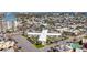 Expansive aerial view showcasing the property's desirable location near city amenities and water views at 7050 Sunset Way # 26, St Pete Beach, FL 33706