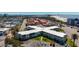 Aerial view of the building complex shows proximity to both the ocean and city at 7050 Sunset Way # 26, St Pete Beach, FL 33706