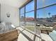 Enclosed balcony with wicker furniture and comfortable seating at 7050 Sunset Way # 26, St Pete Beach, FL 33706