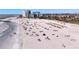 Beautiful beach view with vacationers enjoying sun and sand near buildings and ocean waves at 7050 Sunset Way # 26, St Pete Beach, FL 33706