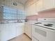 Clean kitchen featuring classic white cabinets and a functional layout perfect for cooking and storage at 7050 Sunset Way # 26, St Pete Beach, FL 33706