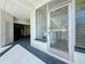 Convenient building laundry room access shown through a secure glass door at 7050 Sunset Way # 26, St Pete Beach, FL 33706