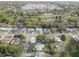 Overhead neighborhood shot with mature trees, manicured lawns, and various single-Gathering homes at 7314 Princeton Dr, Hudson, FL 34667