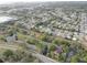 A picturesque aerial shot captures a serene residential area near a winding creek and lush greenery at 7314 Princeton Dr, Hudson, FL 34667