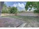 Spacious backyard featuring a brick patio, partial fence, and some green space at 7314 Princeton Dr, Hudson, FL 34667