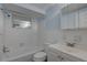 Traditional bathroom with a combined shower and tub, and a classic white color scheme at 7314 Princeton Dr, Hudson, FL 34667