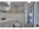 Updated bathroom featuring a modern vanity, updated sink, toilet, and tiled shower at 7314 Princeton Dr, Hudson, FL 34667