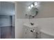 Neat bathroom with a tiled accent wall, modern fixtures, and a spacious layout at 7314 Princeton Dr, Hudson, FL 34667