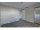 Comfortable bedroom with wood-look floors, a mirrored closet, and a serene atmosphere at 7314 Princeton Dr, Hudson, FL 34667