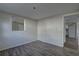 Neutral bedroom offering wood-look floors, abundant natural light, and a versatile layout at 7314 Princeton Dr, Hudson, FL 34667