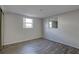 Sunny bedroom featuring wood-look flooring and updated windows, creating a cozy retreat at 7314 Princeton Dr, Hudson, FL 34667