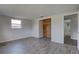 Bedroom featuring hard surface floors and a closet with a door to the bath at 7314 Princeton Dr, Hudson, FL 34667