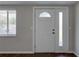 Interior view of the front door with sidelight window, showcasing the home's entry at 7314 Princeton Dr, Hudson, FL 34667