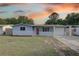 Charming single-story home featuring a stone facade and a well-maintained front yard at 7314 Princeton Dr, Hudson, FL 34667