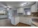 Bright, updated kitchen with a view into the living area and modern tile flooring at 7314 Princeton Dr, Hudson, FL 34667