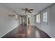 Inviting living room features hardwood floors, a ceiling fan, and plenty of natural light at 7314 Princeton Dr, Hudson, FL 34667