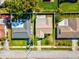 Aerial view highlighting the property lines, roof style, the yard and relation to neighboring homes at 803 Helmsman Way, Palm Harbor, FL 34685