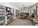 Inviting game room with cozy seating, bookshelves, and a table for board games and socializing at 803 Helmsman Way, Palm Harbor, FL 34685