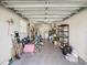 Spacious garage with ample storage space and a door leading to the interior at 803 Helmsman Way, Palm Harbor, FL 34685
