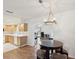 Well-lit kitchen adjacent to an open floor plan featuring a dining nook and office space at 803 Helmsman Way, Palm Harbor, FL 34685