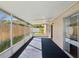 Enclosed back patio offering an enjoyable space to relax outdoors at 803 Helmsman Way, Palm Harbor, FL 34685