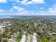 Aerial view showcases the neighborhood, community, and proximity to bay waters at 914 Woodbridge Ct, Safety Harbor, FL 34695