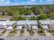 Aerial view of townhome community showing the property layout, garage access, and surrounding neighborhood at 914 Woodbridge Ct, Safety Harbor, FL 34695