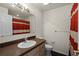 Bathroom featuring a vanity with solid-surface countertop and a tub with shower at 914 Woodbridge Ct, Safety Harbor, FL 34695