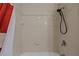 Shower stall with white tile and updated shower head at 914 Woodbridge Ct, Safety Harbor, FL 34695