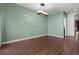 Dining room with wood-look tile flooring, fresh paint, and modern light fixture at 914 Woodbridge Ct, Safety Harbor, FL 34695