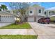 Charming townhome with a two-car garage and a well-maintained front yard at 914 Woodbridge Ct, Safety Harbor, FL 34695