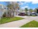 Townhome with attached garages, and lush landscaping at 914 Woodbridge Ct, Safety Harbor, FL 34695