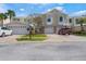 Charming townhome with a two-car garage and a well-maintained front yard at 914 Woodbridge Ct, Safety Harbor, FL 34695