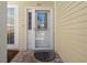 Inviting front door with glass and adjacent window at 914 Woodbridge Ct, Safety Harbor, FL 34695