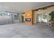 Spacious covered patio with modern fireplace and ceiling fans, great for outdoor entertaining at 914 Woodbridge Ct, Safety Harbor, FL 34695