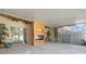 Spacious screened lanai with a modern fireplace, offering a comfortable outdoor living area for relaxation and entertainment at 914 Woodbridge Ct, Safety Harbor, FL 34695